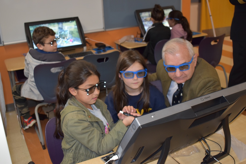 Senator Jack Reed on ZSpace computers with third grade students. 